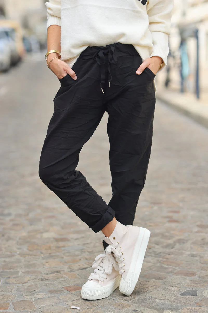 Black comfort and stretch fabric pants with a glitter star