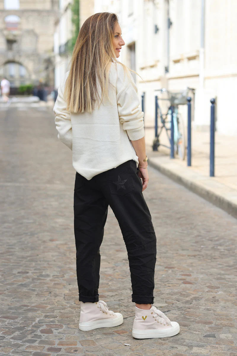Black comfort and stretch fabric pants with a glitter star