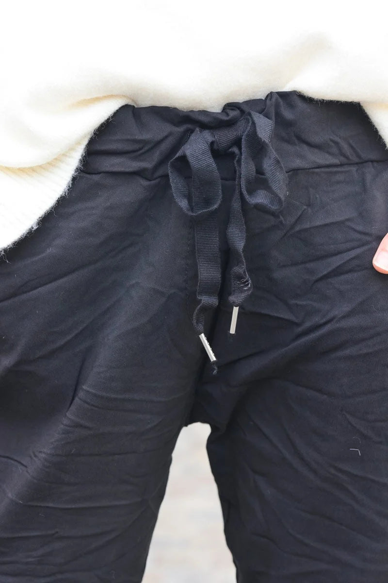 Black comfort and stretch fabric pants with a glitter star