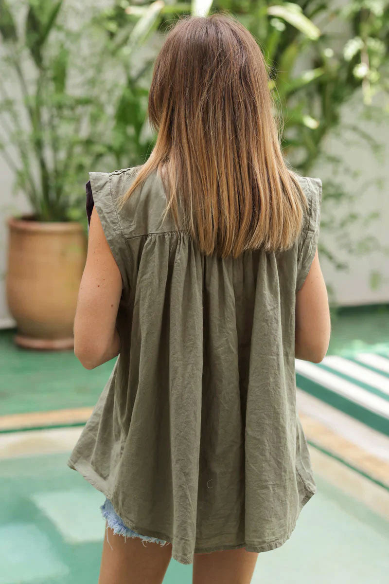 Olive floaty cotton sleeveless blouse with mother of pearl buttons