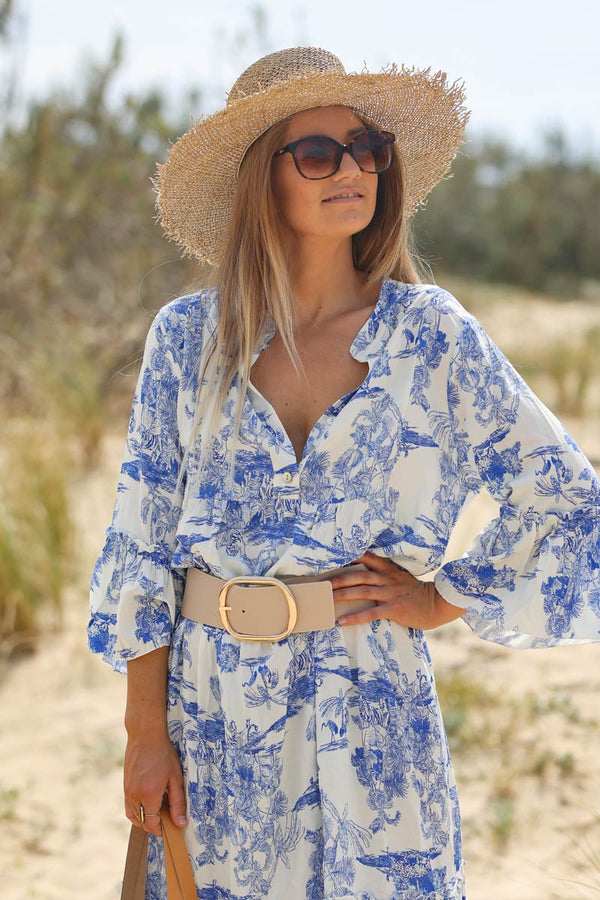 Model wearing Tiered maxi dress with toile de jouy royal blue print