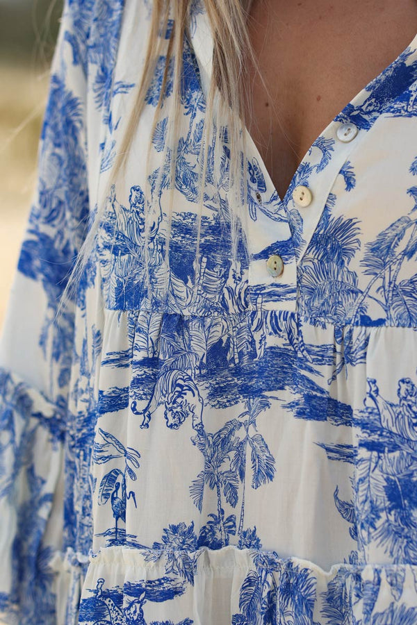 Model wearing Tiered maxi dress with toile de jouy royal blue print