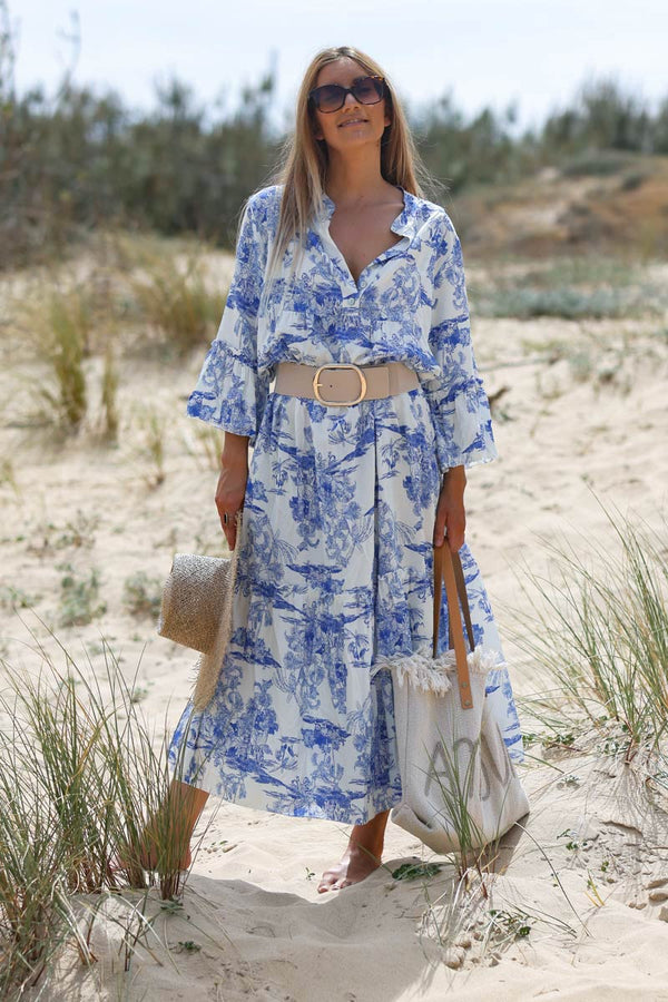 Model wearing Tiered maxi dress with toile de jouy royal blue print