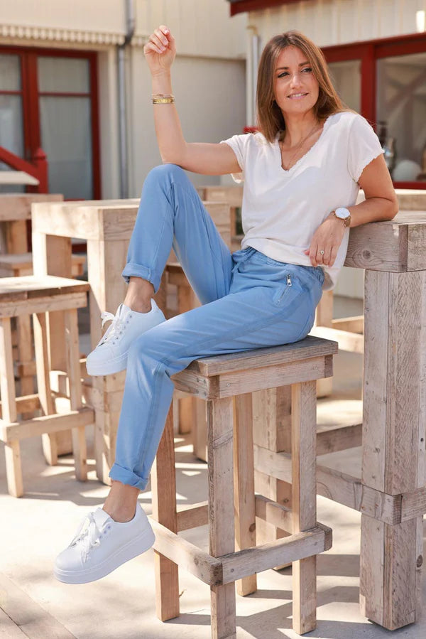 Blue stretch sweatpants with ribbon outseam zipped pockets
