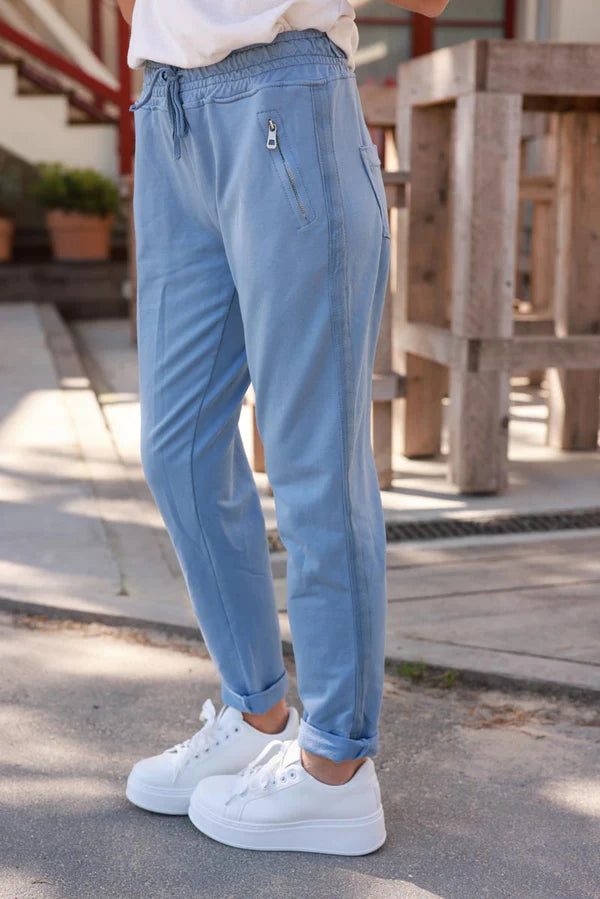 Blue stretch sweatpants with ribbon outseam zipped pockets