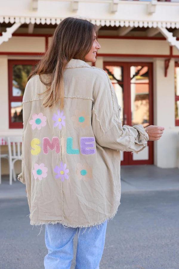 Light Beige denim jacket with 'smile' and flower embroidery