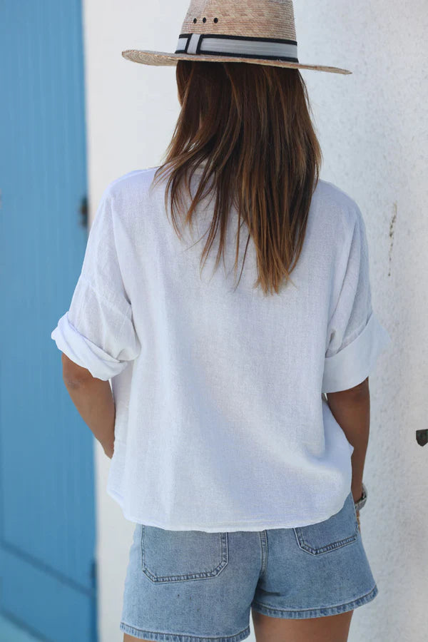 White soft cotton blouse with 3/4 sleeves and large pockets