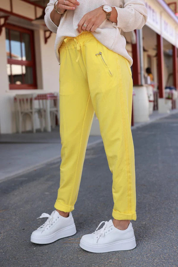 Yellow cotton jogging bottoms with embroidered cheveron outseams