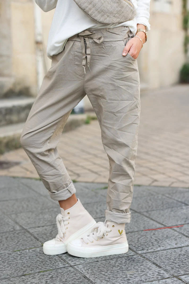 Beige comfort and stretch fabric pants with a glitter star