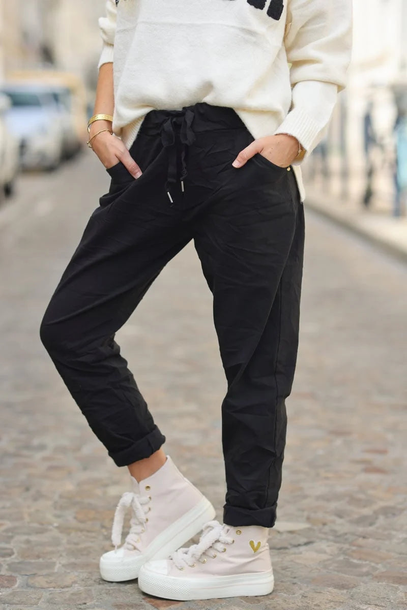 Black comfort and stretch fabric pants with a glitter star