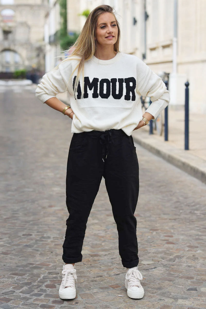 Black comfort and stretch fabric pants with a glitter star