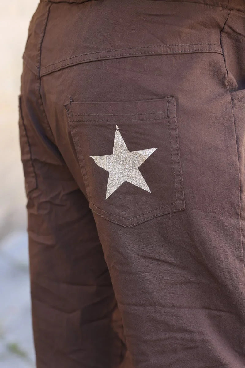 Brown chocolate comfort and stretch fabric pants with a glitter star
