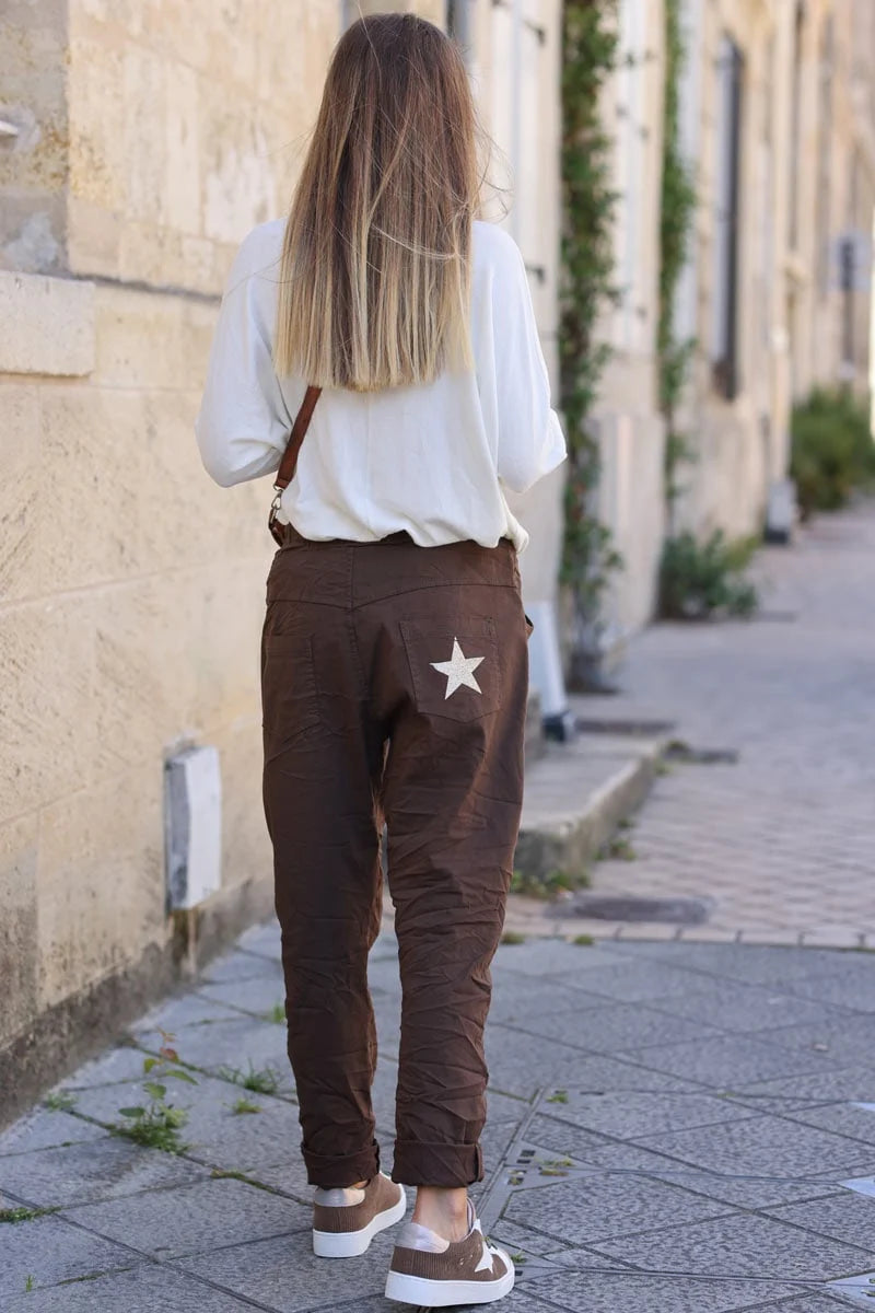 Brown chocolate comfort and stretch fabric pants with a glitter star