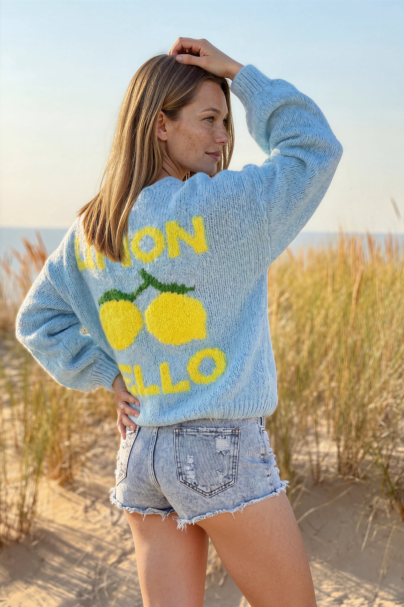 Sky blue chunky knit cardigan with lemon 'limoncello' back pattern