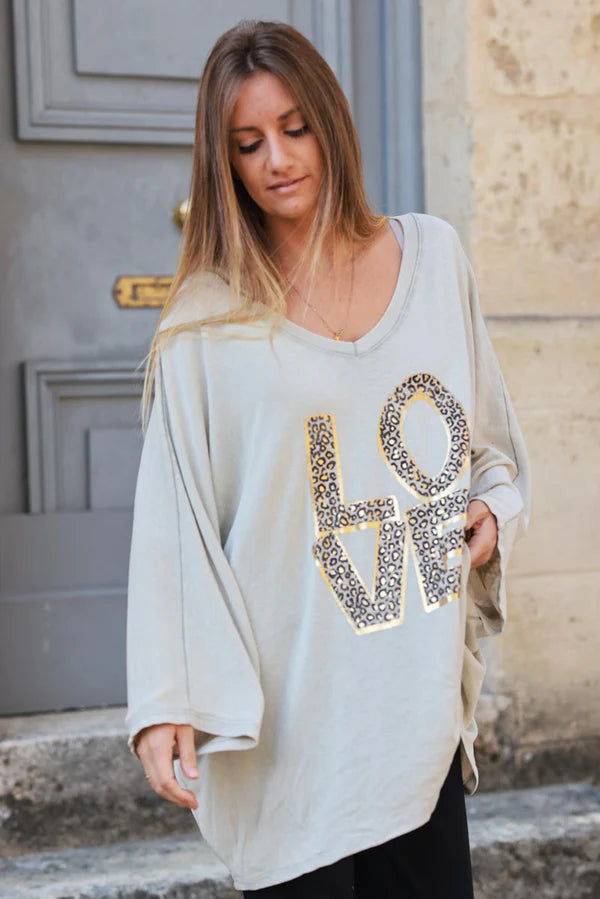 Beige stretch fine knit batwing top with Love print