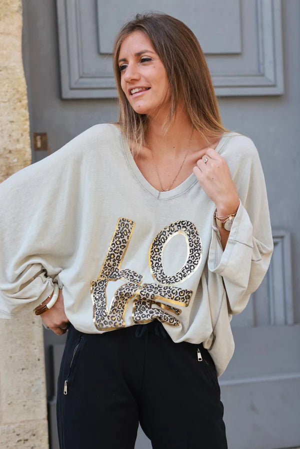 Beige stretch fine knit batwing top with Love print