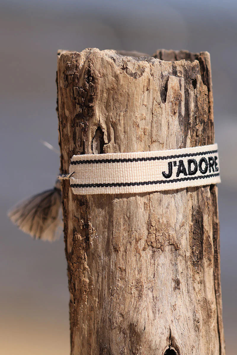 Ecru fabric bracelet with black 'J'adore' embroidery