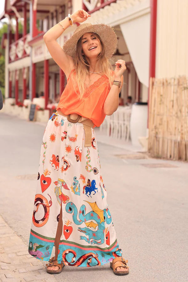 Off white floaty skirt with slit and colorful symbols zodiac signs print