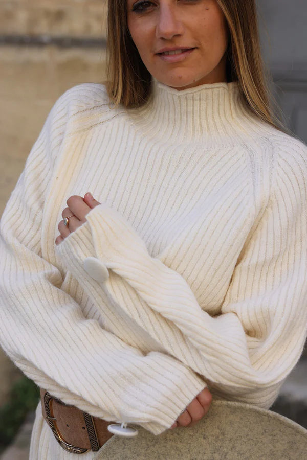 Off white ribbed sweater dress with funnel neck and button cuffs