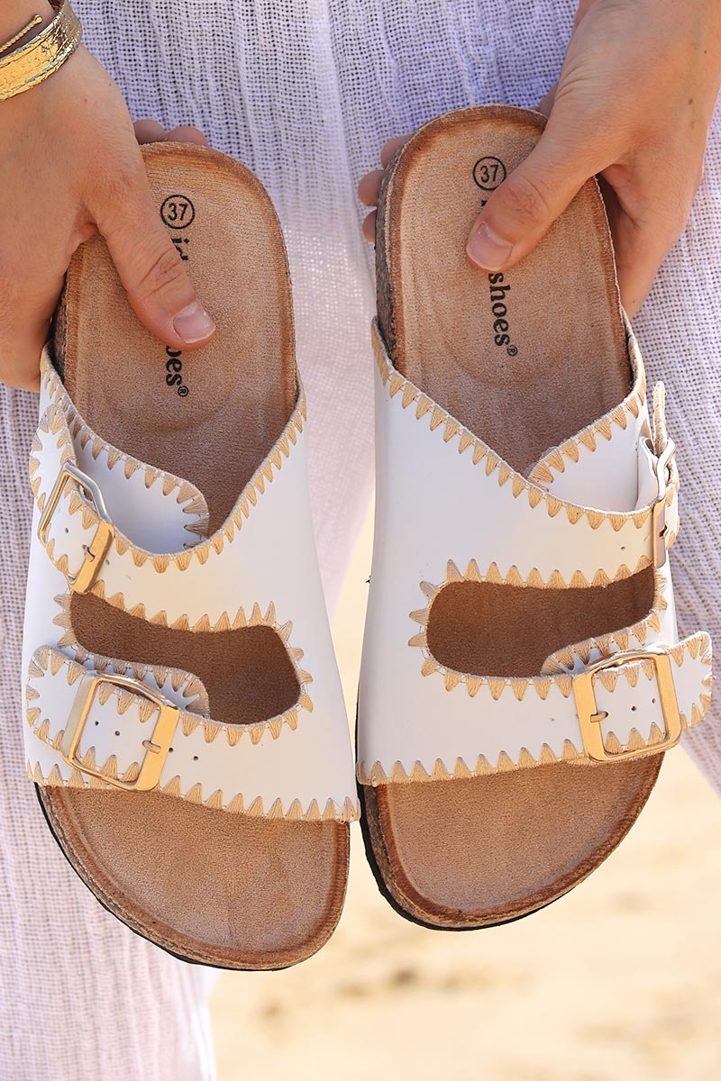 White faux leather sandals with double straps and gold embroidery